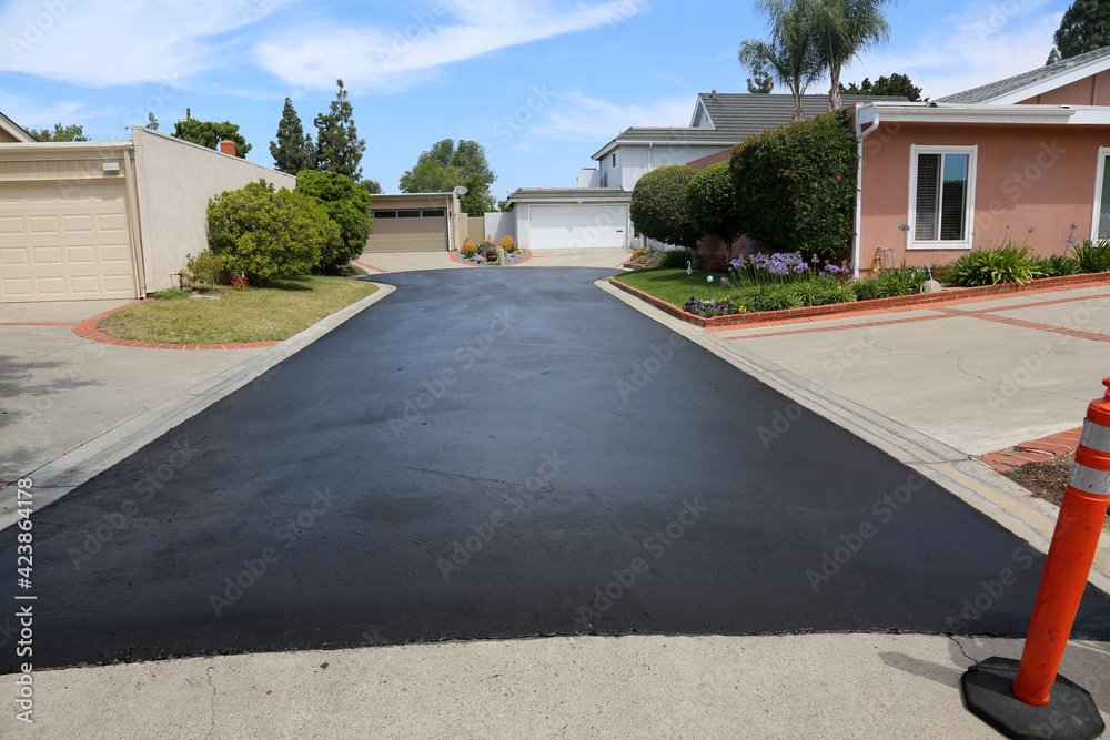 Private drive way, street rehabilitation and slurry seal project finished with crews expertly applying the slurry seal. Re-surfaced Cul-de-sac or driveway.